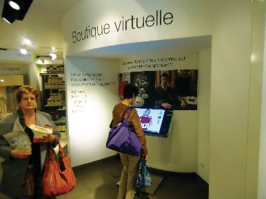 Marks and Spencer pushes its social network presence in its windows and shoppers can order products at the ‘boutique virtuelle’