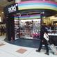 The Add shop is kiosk-like, but stands out due to its height and use of colourful signage